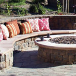 A fire pit with built-in seating.