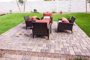 An attractive paved patio and seating area.