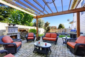 A spacious outdoor patio constructed of pavers.