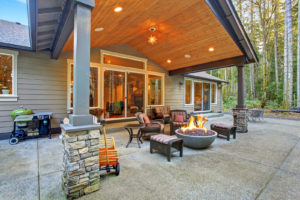 An inviting patio featuring many amenities.