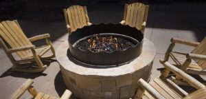 An outdoor fire pit with surrounding seating.