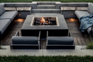 An outdoor fire pit with built-in seating.