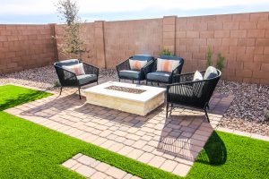 An attractive paver patio with fire pit.